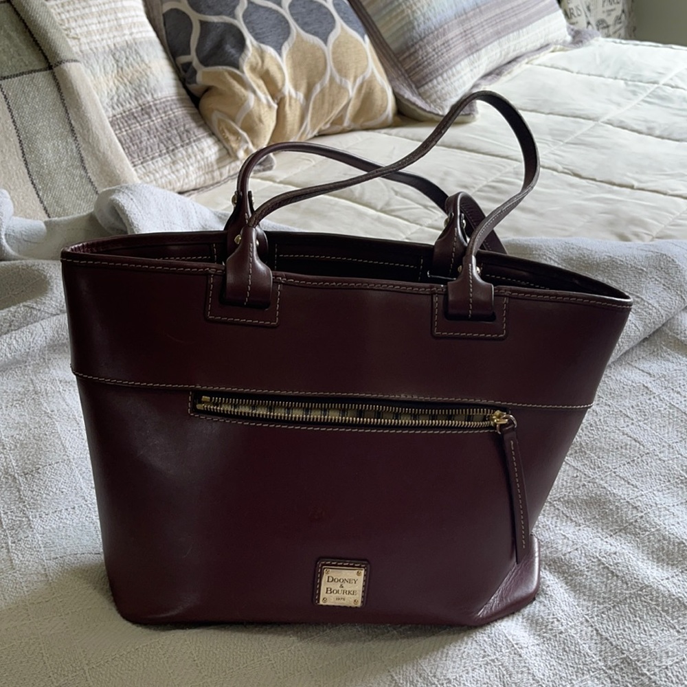 Dooney snd Bourke tote carried on shoulder 90% of the time.